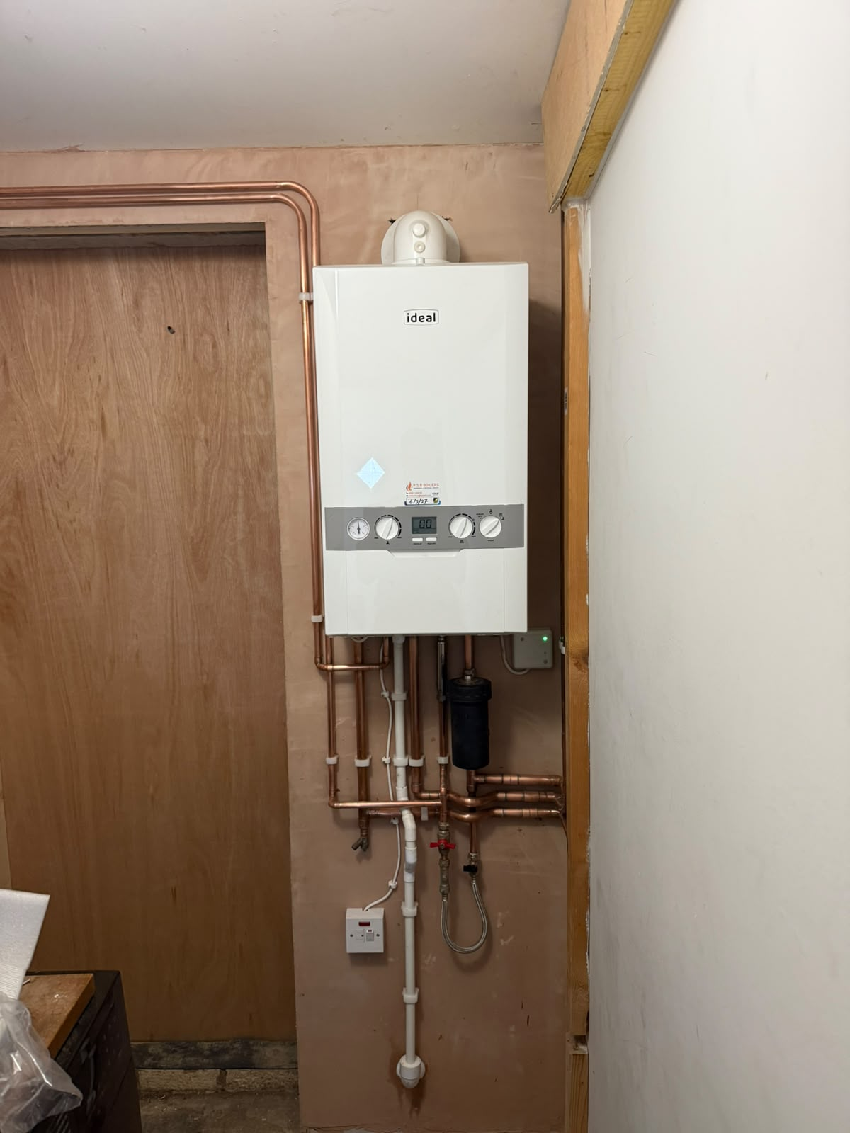 New Ideal combi boiler installation with neat copper pipework, magnetic system filter and fused spur — Gas Safe boiler install by On-Tap Plumbing & Heating Bedfordshire