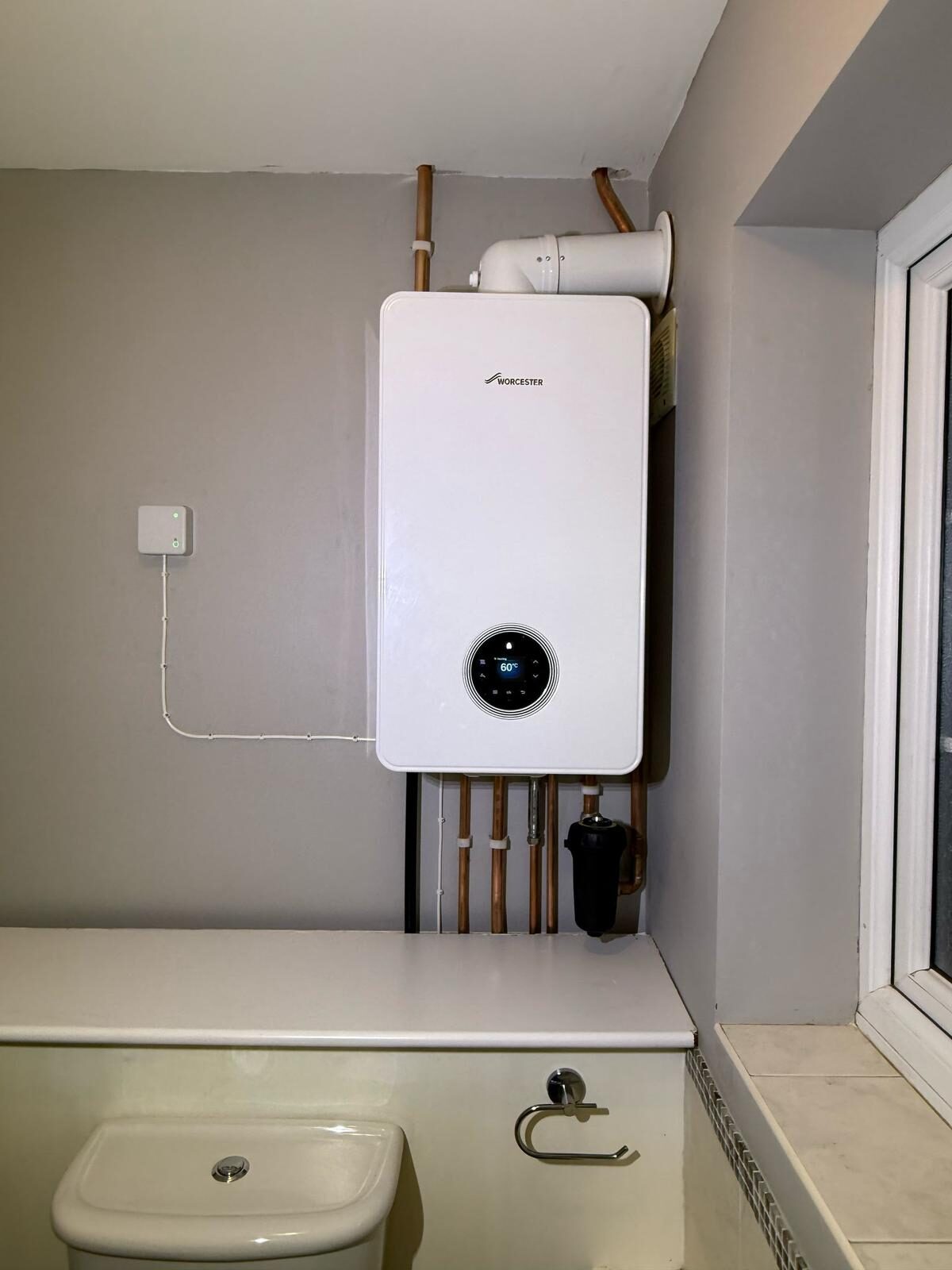Wall-hung combi boiler installation with copper pipework below — Gas Safe boiler swap by On-Tap Plumbing & Heating